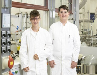 M. Jost and J. Schäfer, apprentice chemistry lab technicians